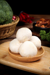 Freshly Picked White Mushrooms on Wooden Plate with Vegetables Indoor Food Photography