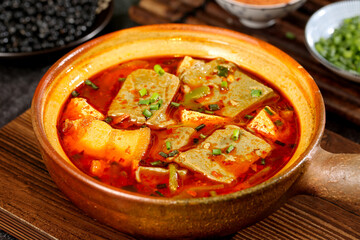 Traditional Yunnan Spicy Tofu Stew in Clay Pot - Authentic Chinese Cuisine with Red Chili Broth