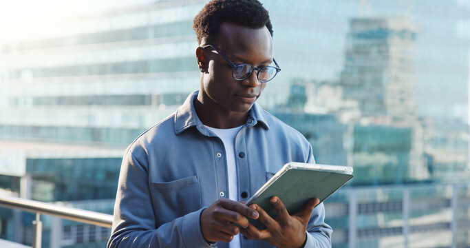 Business man, tablet and reading in city with analysis, review or research for economic report. Black person, technology and male economist on balcony with digital study or survey for fiscal policy - Powered by Adobe