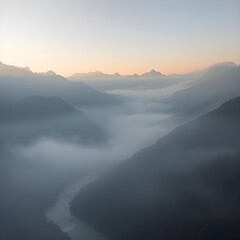 Misty mountain valley at dawn, river winding like silver thread.