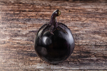 Raw round black big eggplant