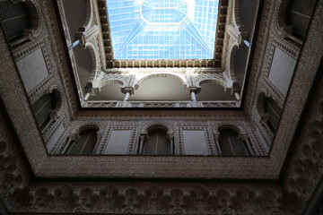Moorish architecture in the courtyard of the doll gallery Alcazar of Seville, Andalusia, Spain