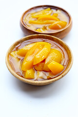 Sliced peaches in syrup served in a bowl