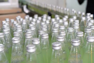 Factory of food or beverages, Conveyor for feed bottle, food or beverages on warehouse before send product to the customer. Quality control or assurance, Good standard