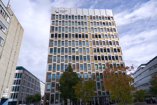 Looking up modern office tower of University of Zurich life science campus at Swiss city of Schlieren on a late summer day. Photo taken September 16th, 2025, Zurich Schlieren, Switzerland.
