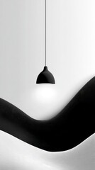 A minimalist monochrome image featuring a pendant lamp illuminating a subtly undulating black and white surface