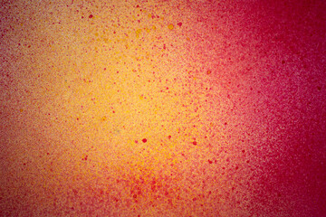 赤色と黄色のスプレー塗料で塗った背景