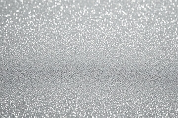 Fototapeta premium Closeup macro shot of sparkling silver glitter, creating a festive and celebratory background with a shallow depth of field