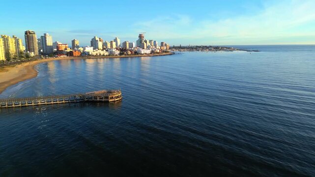 Scenic Aerial Over Mansa Beach Pier Towards Punta del Este Peninsula