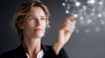 Focused businesswoman touching futuristic digital network interface