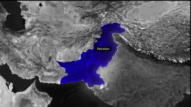 A blue shaded map of pakistan surrounded by grayscale landmasses and mountainous regions view from space
