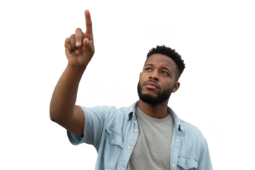 Young black man pointing upward gazing thoughtfully engaged with interactive technology transparent background