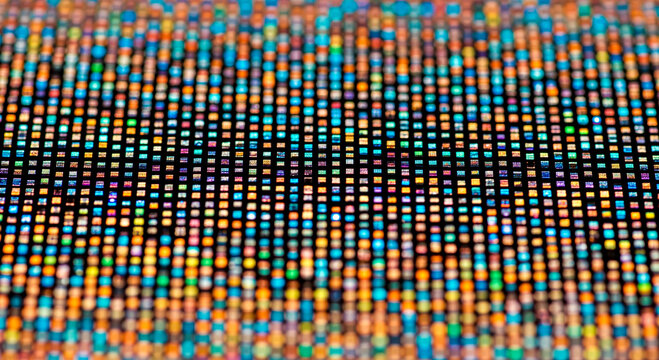 Macro detail of oled screen showing individual rgb sub-pixels, abstract technology background with colorful grid for modern television and computer display