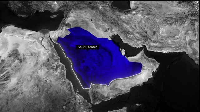 Satellite view of saudi arabia highlighted in blue against grayscale middle eastern landscape