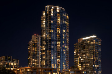 Fototapeta premium A luxury condominium tower glowing at night Windows sparkle across the skyline The mood feels glamorous and vibrant