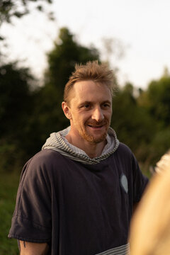 Smiling Man With Beard Outdoors In Natural Light