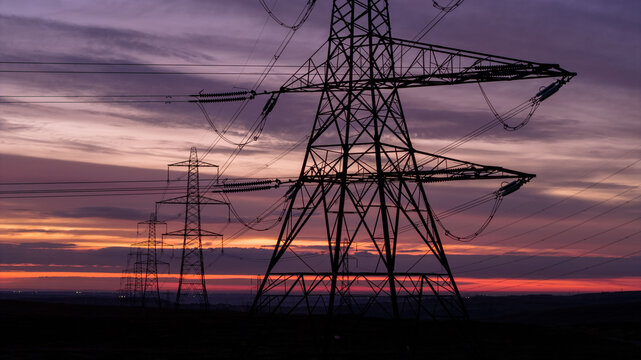 Sunrise over Electricity Pylons Across Rishworth Moor  Yorkshire