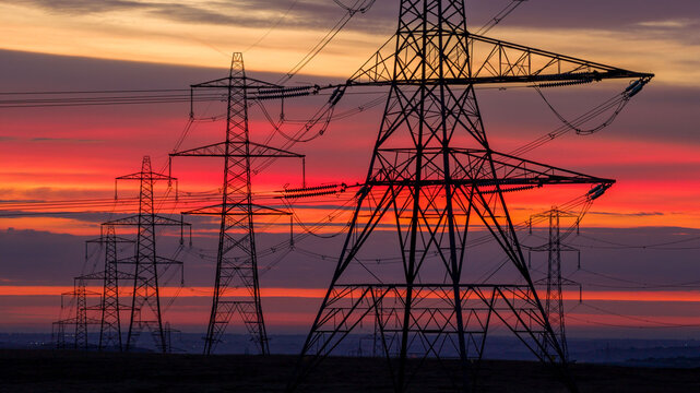 Sunrise over Electricity Pylons Across Rishworth Moor  Yorkshire