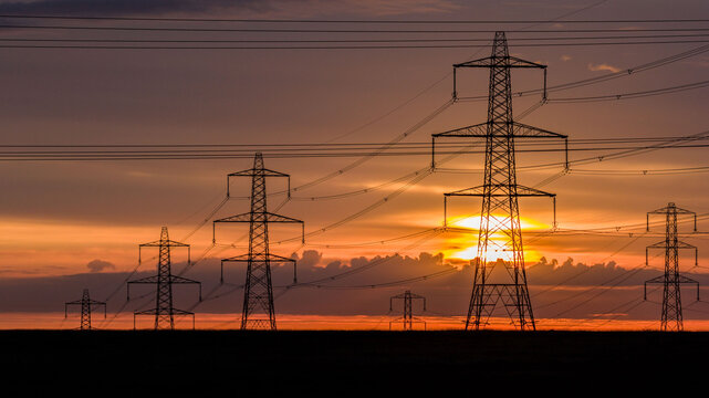Sunrise over Electricity Pylons Across Rishworth Moor  Yorkshire
