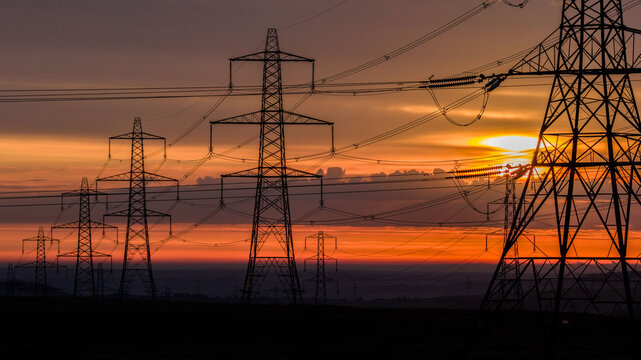 Sunrise over Electricity Pylons Across Rishworth Moor  Yorkshire