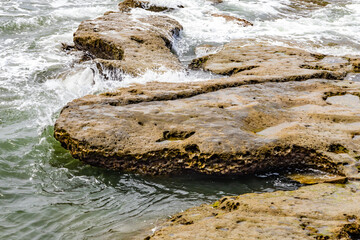 Waves wash the rocky shore

