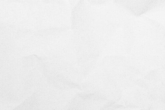 White recycled craft paper texture as background. Grey paper texture, Old vintage page or grunge vignette of old newspaper. Pattern rough art creased grunge letter. Hardboard with copy space for text.