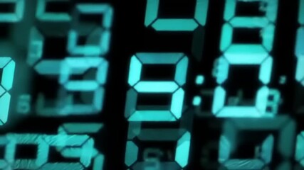 Close-up of vibrant turquoise digital numbers flickering and changing rapidly on a black screen - Powered by Adobe