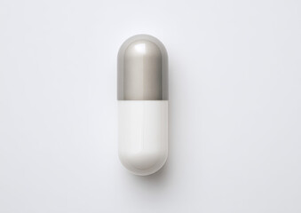 Single silver-and-white capsule on a plain white background