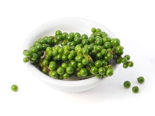Green peppercorn in bowl isolated on white background