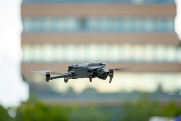 Professional drone with camera is hovering