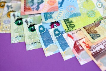 Bahraini dinar money bills in big amount on purple. Finance and banking concept