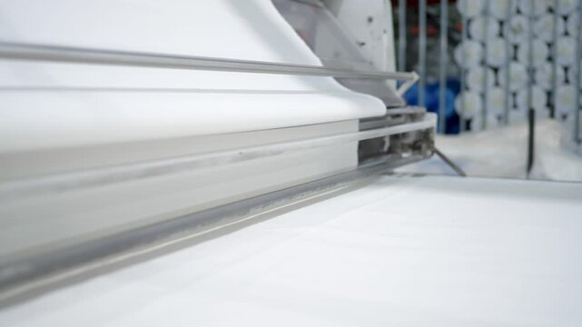 close view of fabric rolling process in sialkot tent production factory