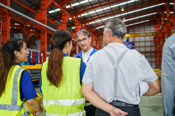Morning briefing and meeting of workers and engineers in factory.