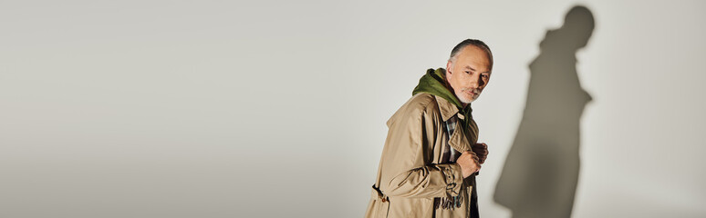 Stylish senior man showcases modern fashion trends with confidence and flair