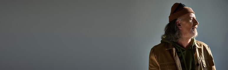 Charming senior man exudes elegance in stylish attire showcasing timeless fashion trends