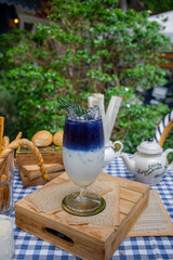 Enchanting Butterfly Pea Flower Drink: A refreshing drink with layers of vivid color and subtle elegance.