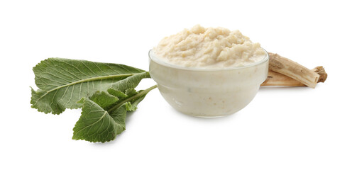 Tasty horseradish sauce in bowl, roots and leaves isolated on white