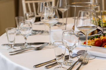 Elegant festive table setting in a restaurant for a holiday dinner party
