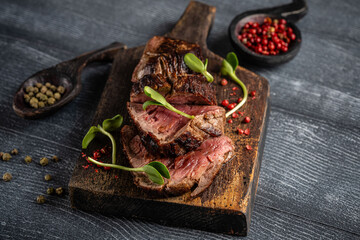 Grilled beef steak slices with herbs