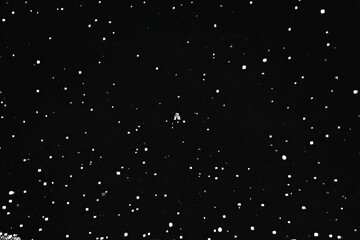 Deep space, scattered white dots against black backdrop, small cluster of light