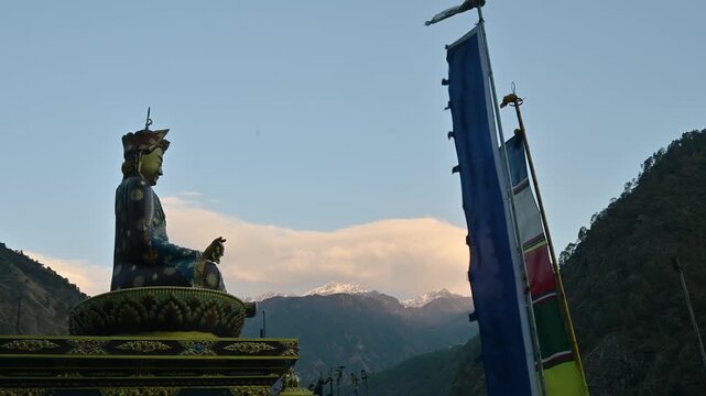 Statue of Guru Rinpoche on the small hill in Syabrubesi a beautiful resident village inside the Langtang National Park of Nepal.