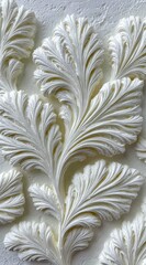 Ornate, white, embossed floral design