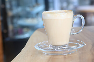 cappuccino, coffee in a clear glass cup in a cafe, soft color background food and drink, hot drink
