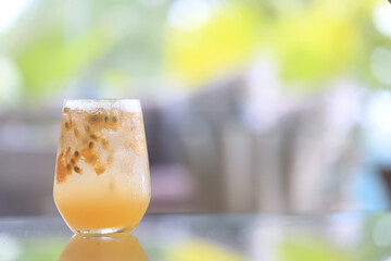 passion fruit lemonade background, cold lemonade in a glass, delicate texture cold tropical drink background