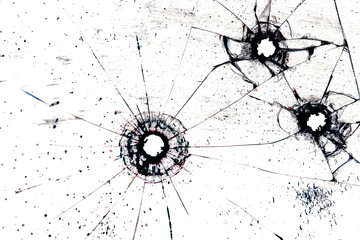 bullet marks on glass on a white background, cracks and holes from shots on broken glass, for...