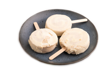 Сhocolate Ice cream in white glaze isolated on white, side view, close up