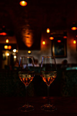 a glass of cold white wine and serving in the restaurant