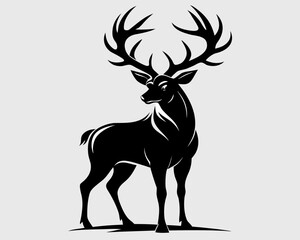 Majestic black stag with large antlers standing against a light gray background