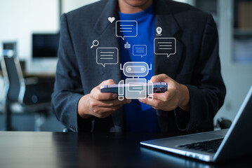 A professional man works on his laptop, using a futuristic digital interface. Ideal for concepts of business, innovation, technology, and modern life.