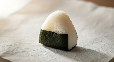 Closeup of a delicious onigiri, a japanese rice ball wrapped in nori seaweed